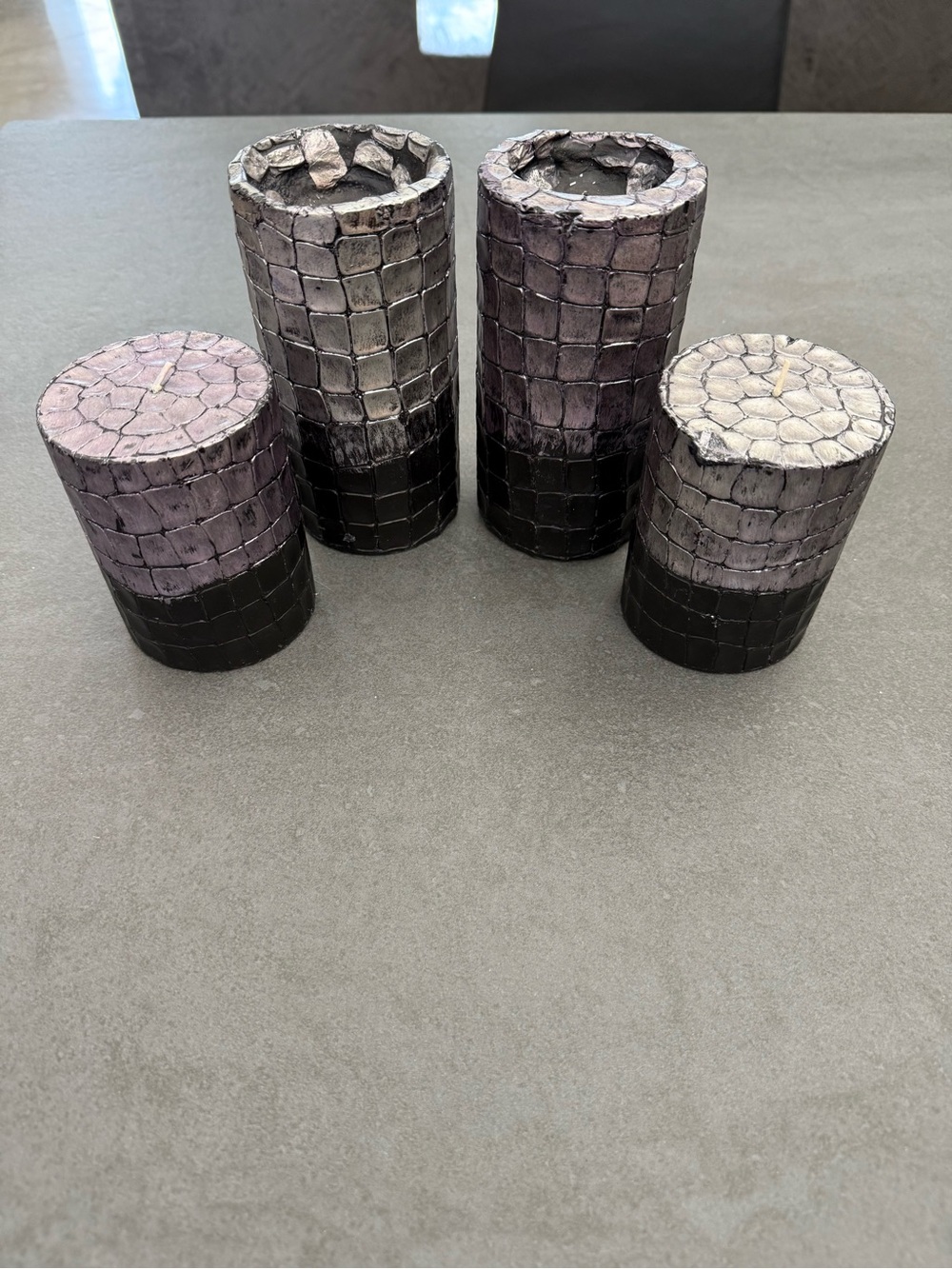 4 Decorative Black w/metallic silver/purple hue pillar candles.